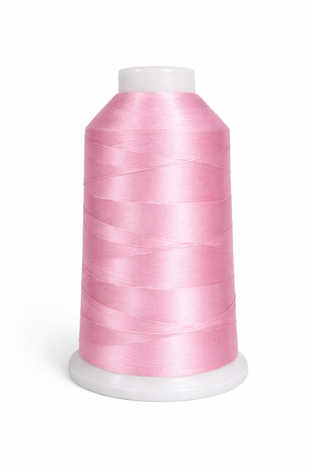 Spool of pink thread on a white background