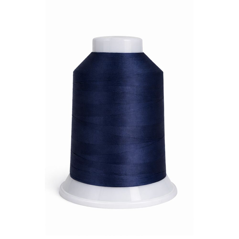 Spool of dark blue thread on a white background