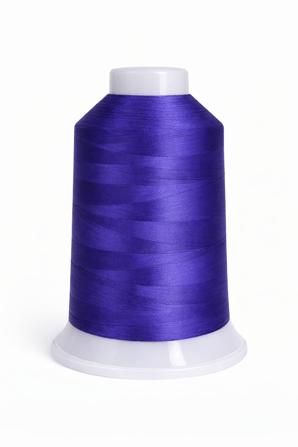 Spool of purple thread on a white background