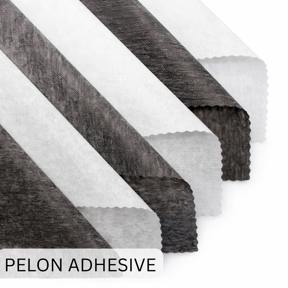 Pelon Adhesive with gray and white fabric swatches on a white background