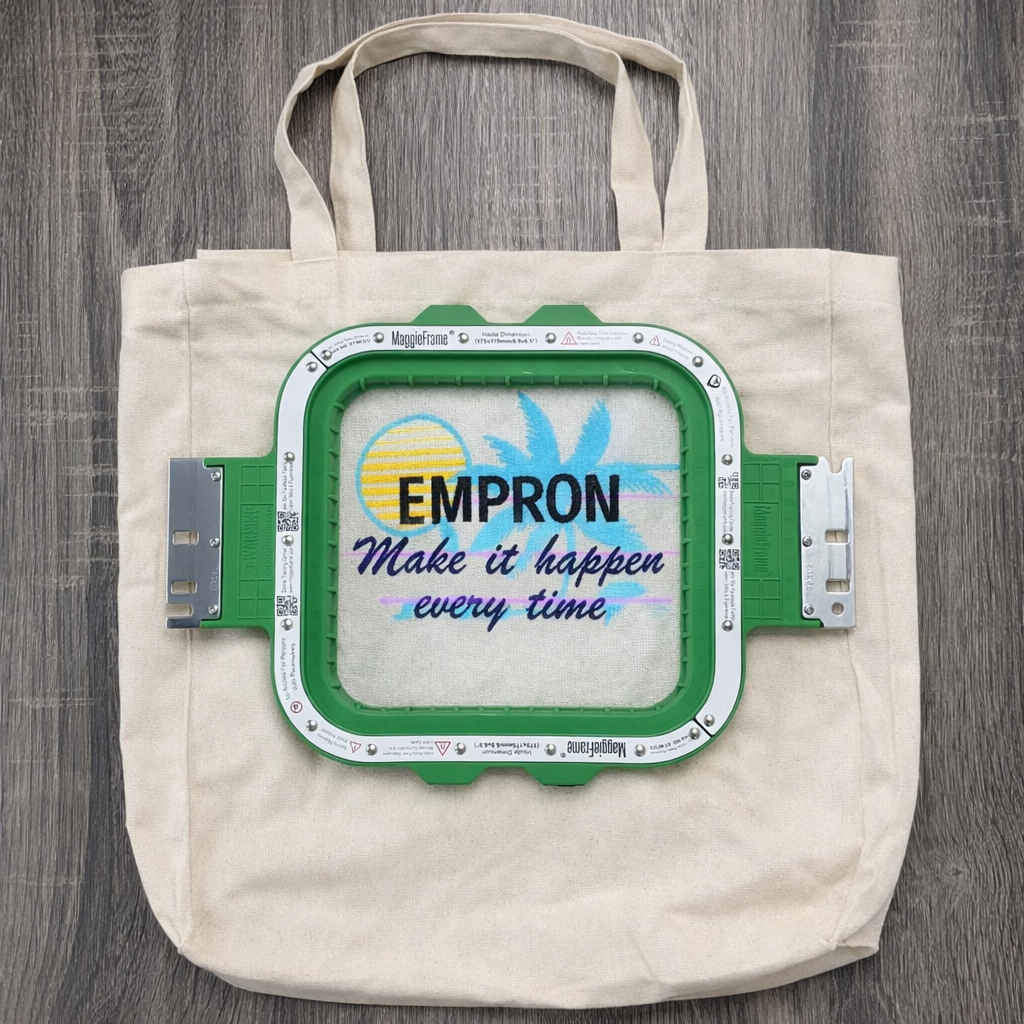 Tote bag with an embroidery machine, green embroidery hoop with dimensions 6.9" x 6.9" 