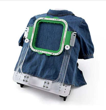 Denim jacket with a futuristic green and silver chest piece on a white background