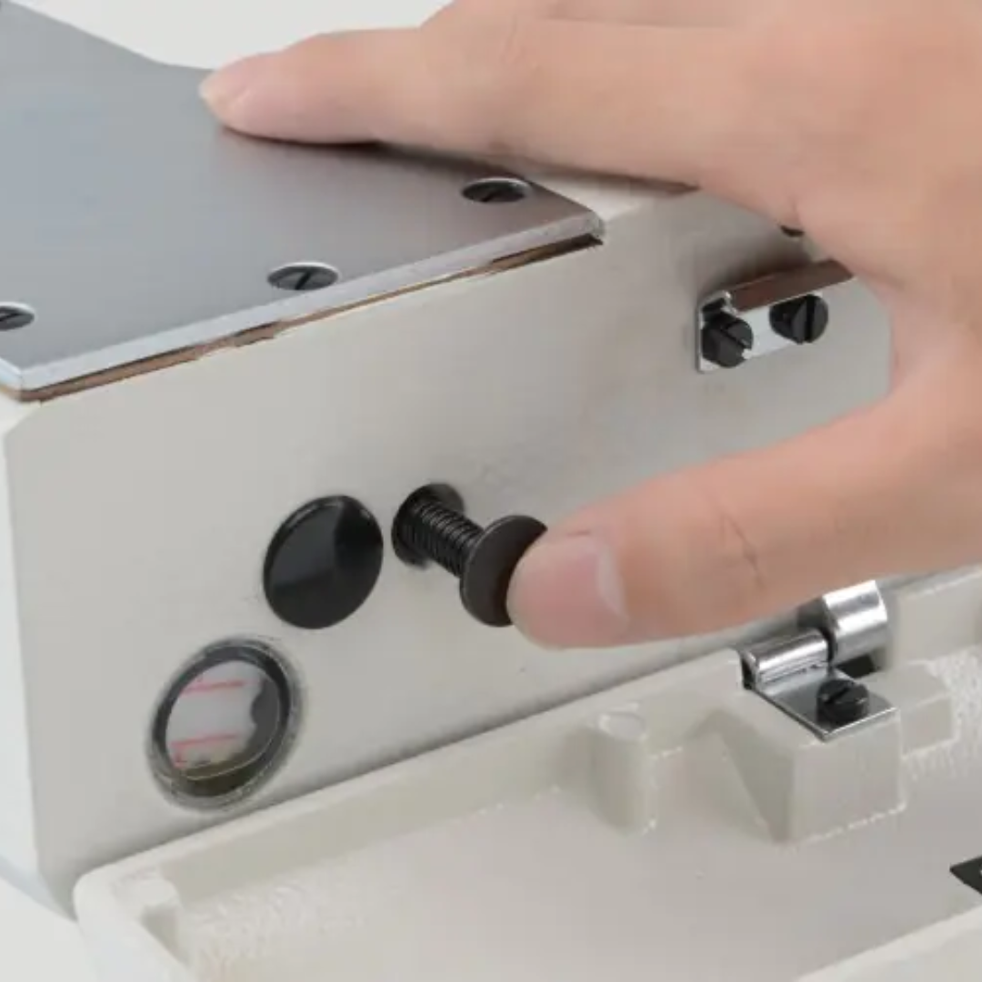 JACKJK-T9270D-12-2PL-Q_1-4_-5 Hand adjusting a metal component with screws on a white background