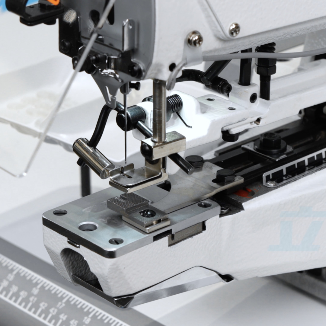 JK-1377E-5 Close-up of a sewing machine needle and mechanism on a white background
