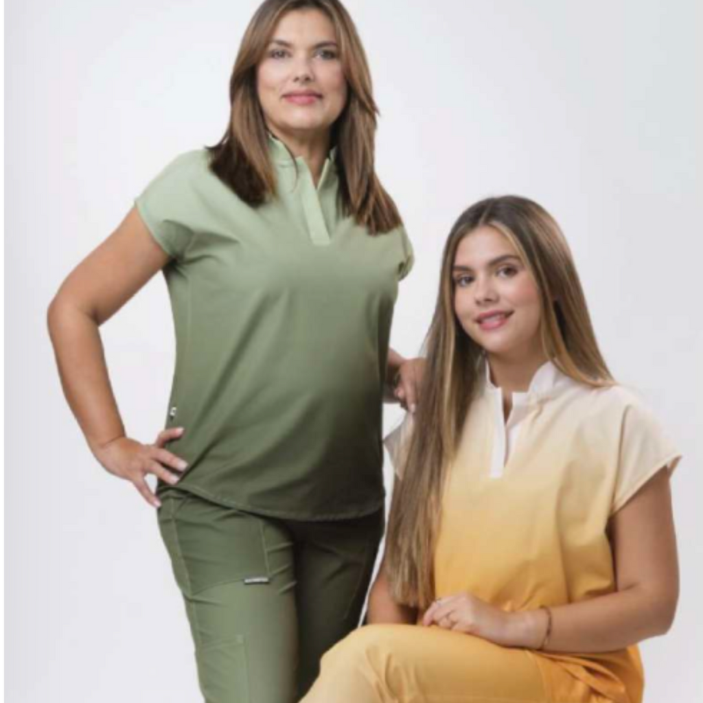 Two women wearing green and yellow outfits on a white background