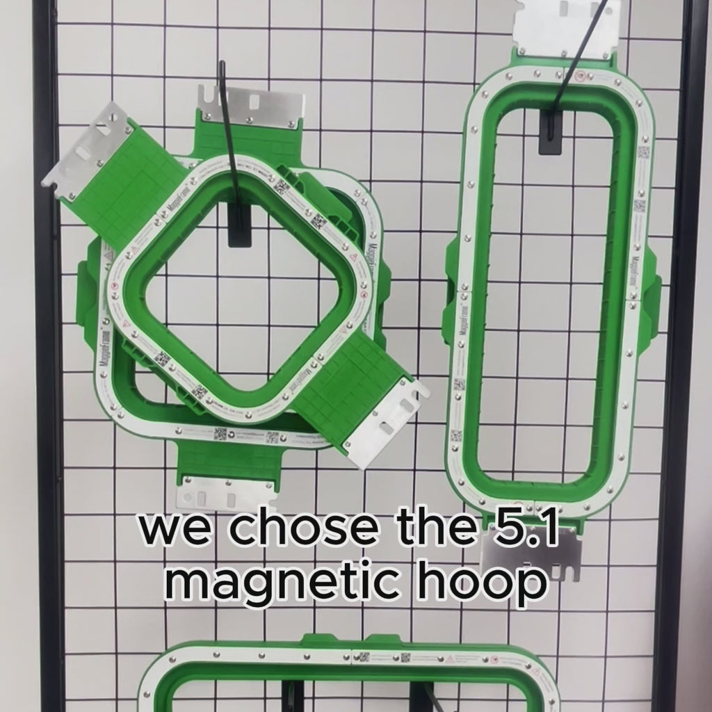 Green embroidery machine hoop with dimensions 7.7" x 12.5" on a white background